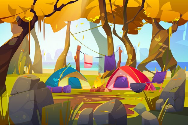 秋の森の火と観光用品のキャンプテント