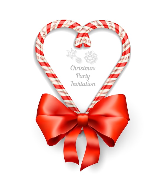 Candy canes in heart shape frame with text for christmas invitation