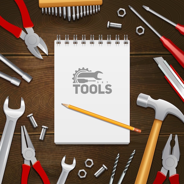 Carpentry construction repair instruments tools with notebook composition on dark wood background 