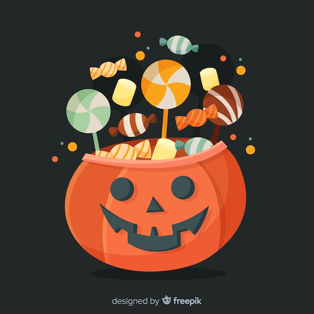 Carved pumpkin with candies for halloween