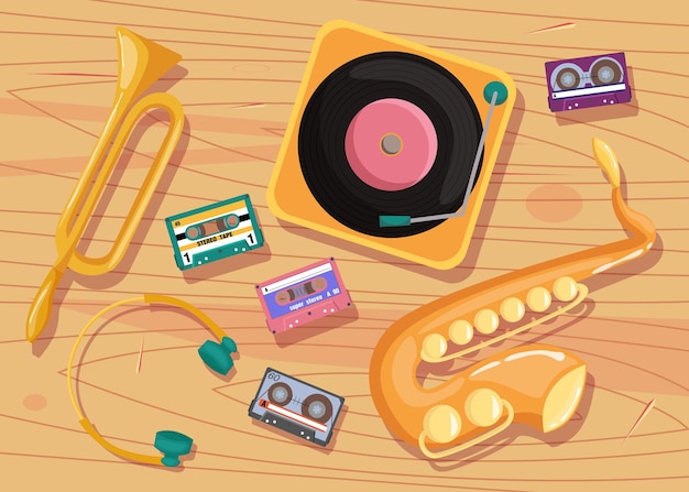 Cassette tapes, vinyl player and musical instruments on table.