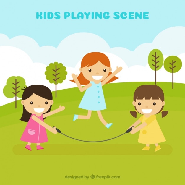 Cheerful girls playing with jump rope outdoors