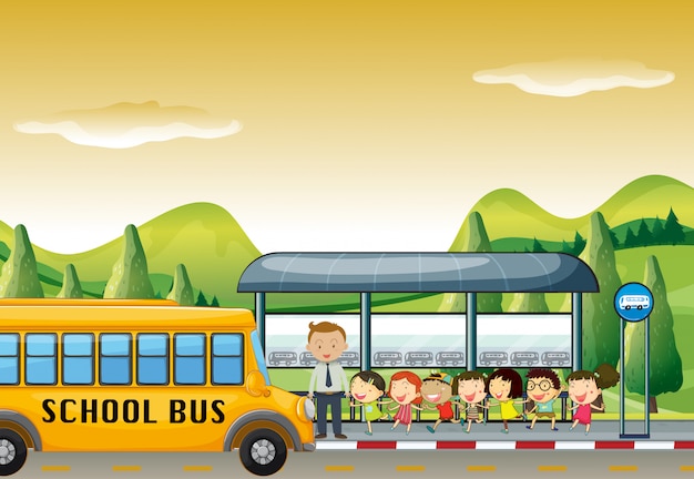 バス停でスクールバスに乗る子供たち