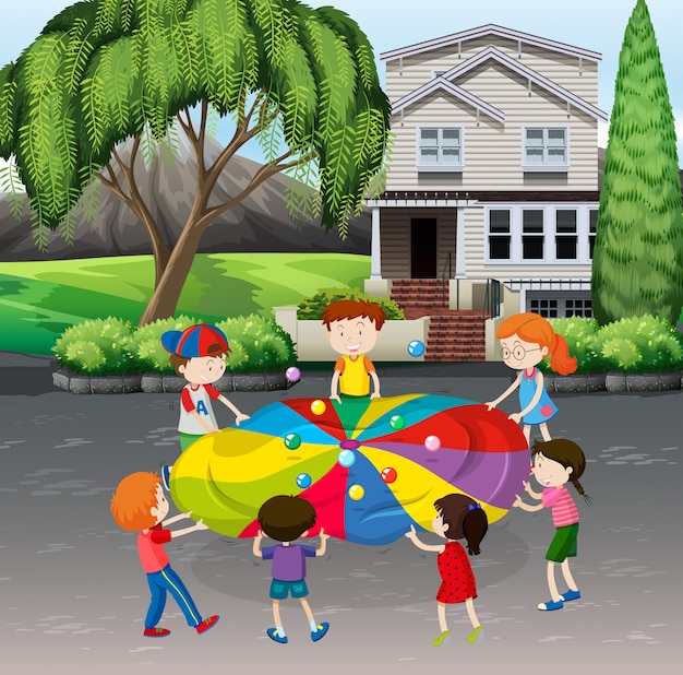 Children playing balance balls on the street