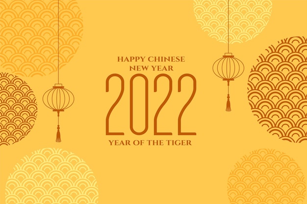 Празднование китайского нового года 2022 на желтом фоне Бесплатные векторы