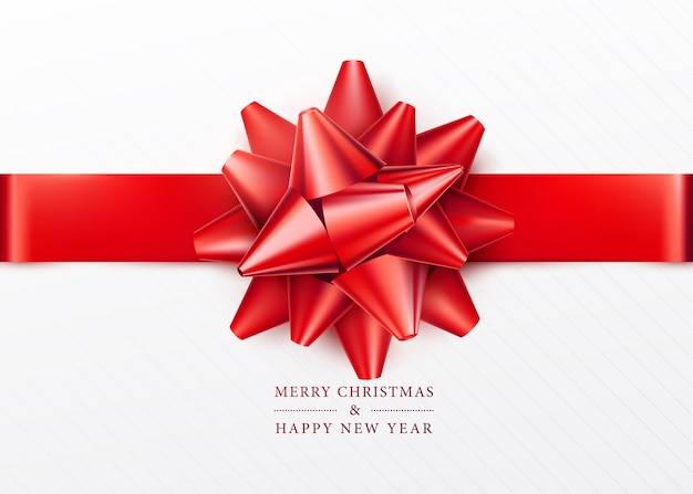 Christmas background. White gift box with red bow and ribbon. Top view. Greeting text sign. Merry xmas and happy new year.