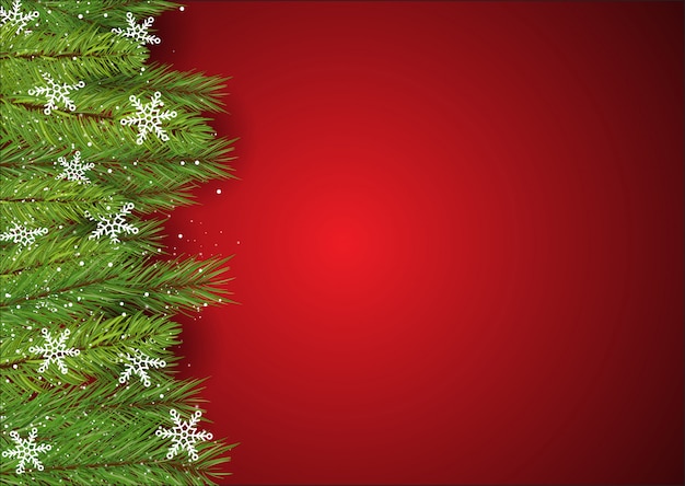 Christmas background with pine tree branches and snowflakes