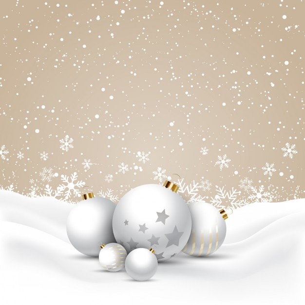 Christmas baubles nestled in snow background