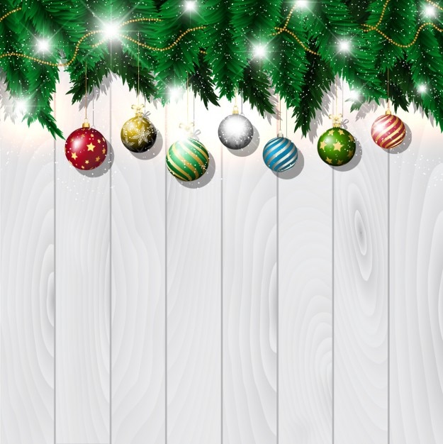 Christmas baubles on white wood background