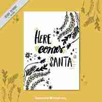 Free vector christmas card with message and hand drawn natural ornaments