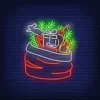 Free vector christmas gifts in sack in neon style