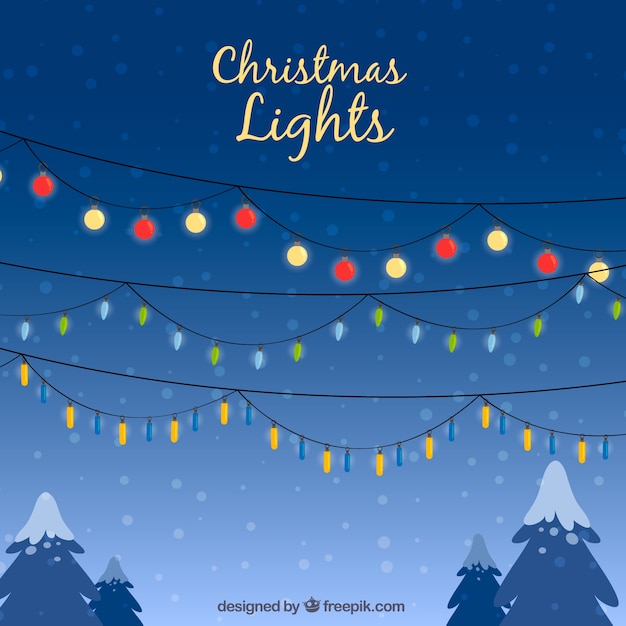 Free vector christmas lights in a winter sky