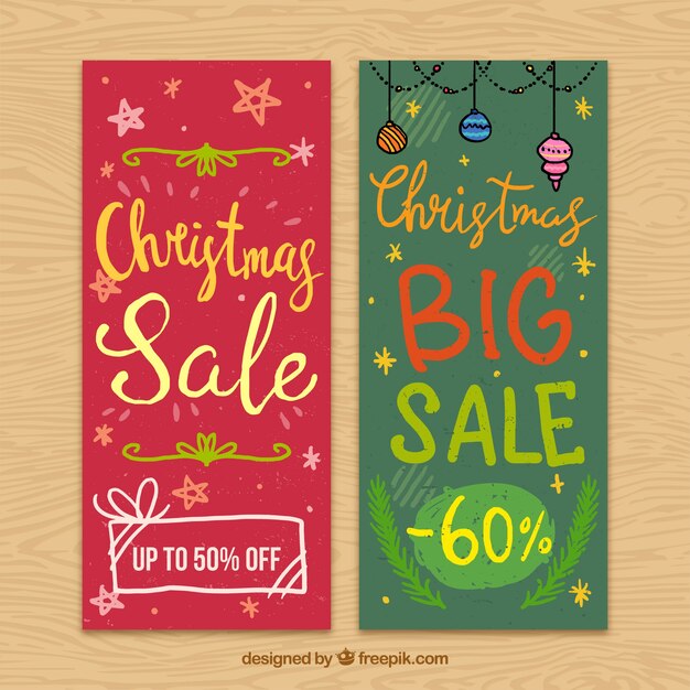 Free vector christmas sale banners with hand-drawn elements