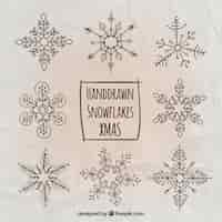 Free vector christmas snowflakes in hand drawn style