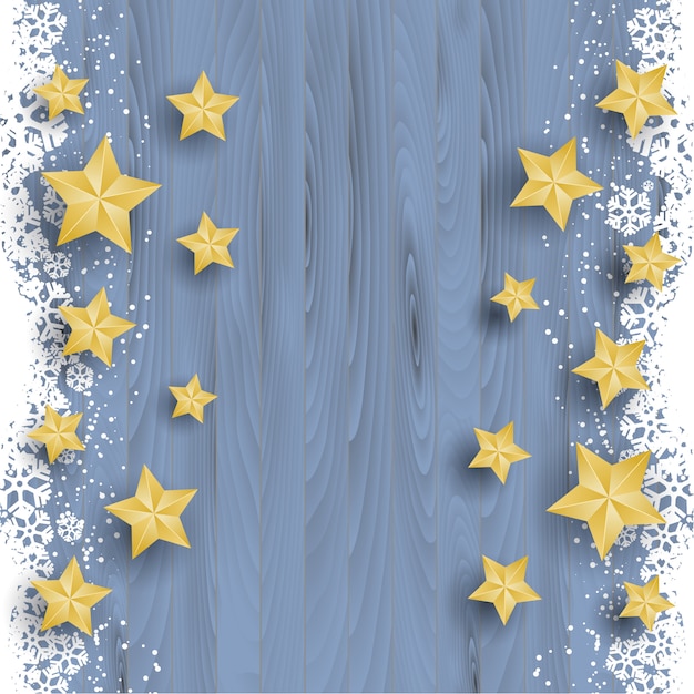 Christmas stars on snowy wood background 