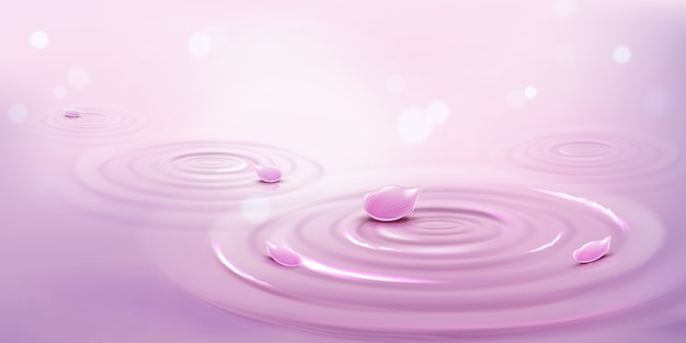 Круги на воде и розовые лепестки цветов, фон волны