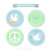 Free vector circular badges with symbols of peace