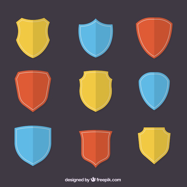 Collection of colored shields in flat design