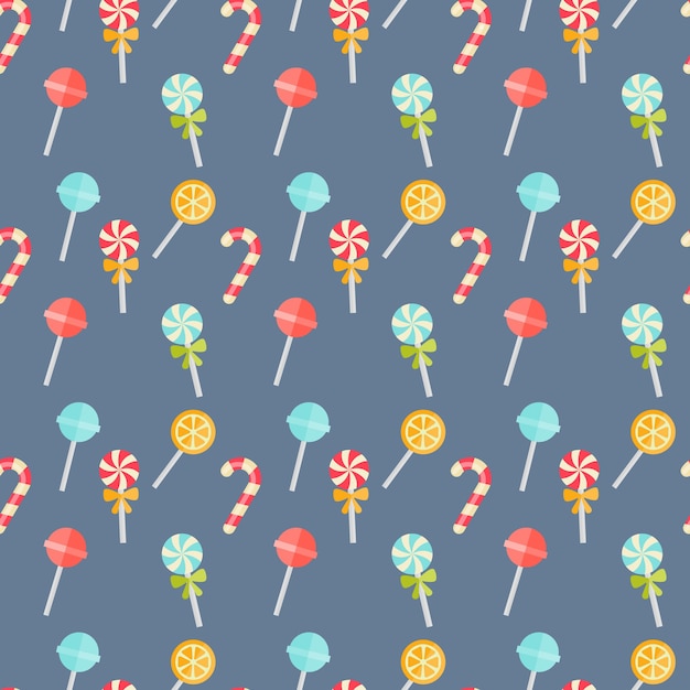 Colorful candy seamless background pattern on blue with festive candy canes