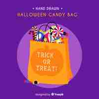 Free vector colorful halloween candy bag with flat design