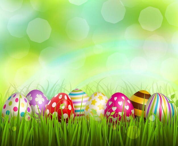 Colorful painted easter eggs on green grass on blurred  with bokeh realistic 
