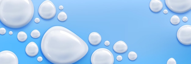 Free vector cream or milk drops on blue background cosmetics