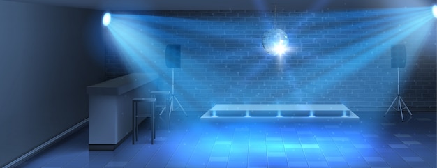 Dance floor with empty stage in nightclub