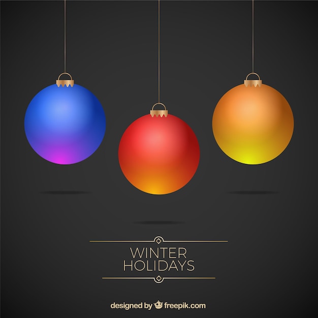 Dark background of three colorful christmas balls
