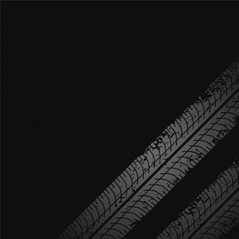 Sfondo scuro con segni di stampa di pneumatici