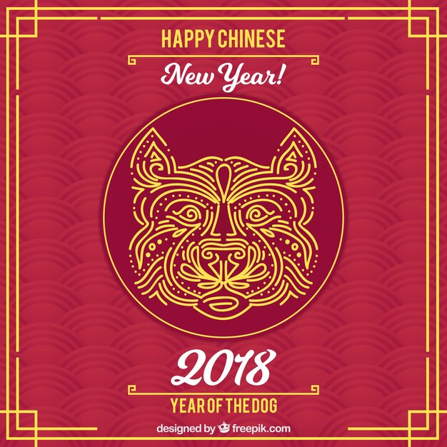 犬の顔と暗赤い中国の新年の背景