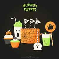 Free vector delicious cake with other halloween candy