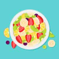 Free vector delicious fruit salad in white bowl top view