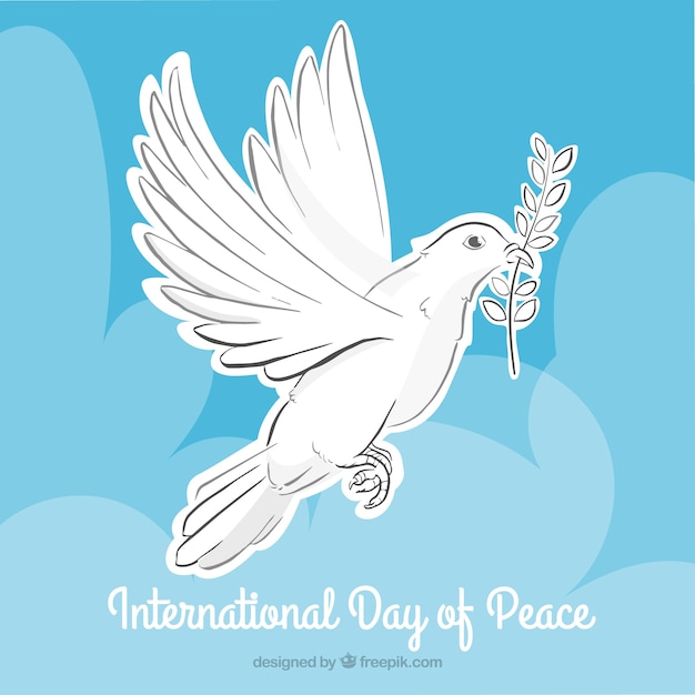 Free vector dove holding an olive branch with clouds background