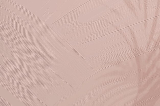Тускло-розовая краска текстуры фона с тенью листа
