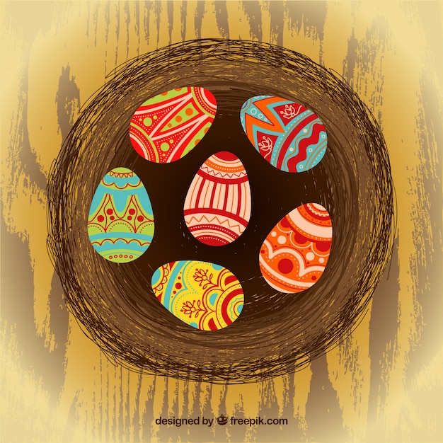 Free vector easter eggs on abstract nest