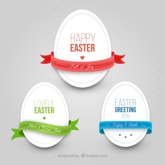 Free vector easter eggs with ribbons in cut-out style