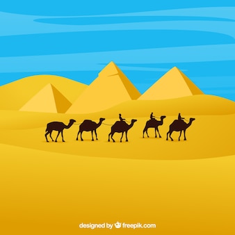 Paesaggio dell'egitto con carovana e piramidi