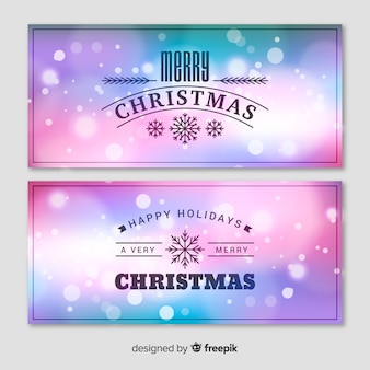Elegant christmas banner set with blurry background Free Vector