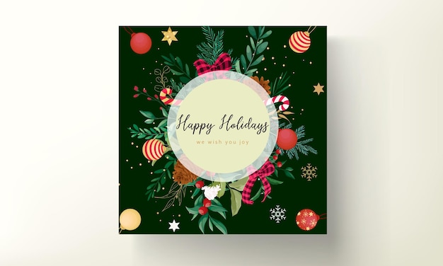 Free vector elegant christmas card design with christmas ornaments and beautiful leaves