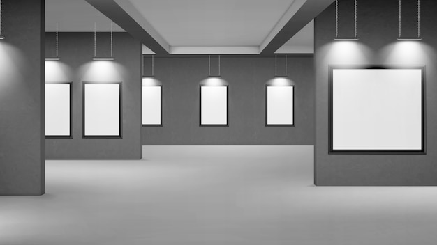 Empty gallery with blank picture frames illuminated by spotlights.