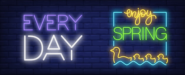 Enjoy spring every day neon sign. mother and baby ducks floating on water.