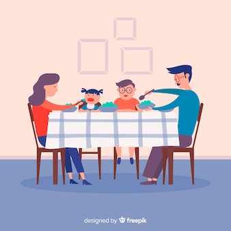 테이블 주위에 앉아있는 가족