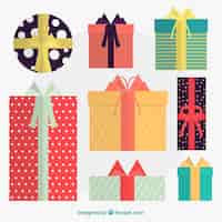 Free vector fantastic pack of christmas gifts with colorful ribbons