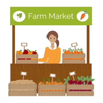 野菜と値札が付いている農場の市場のスタンドの正面の木箱
