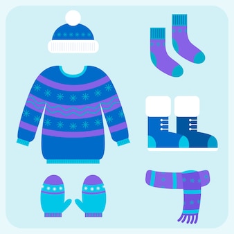 Flat design winter clothes and essentials