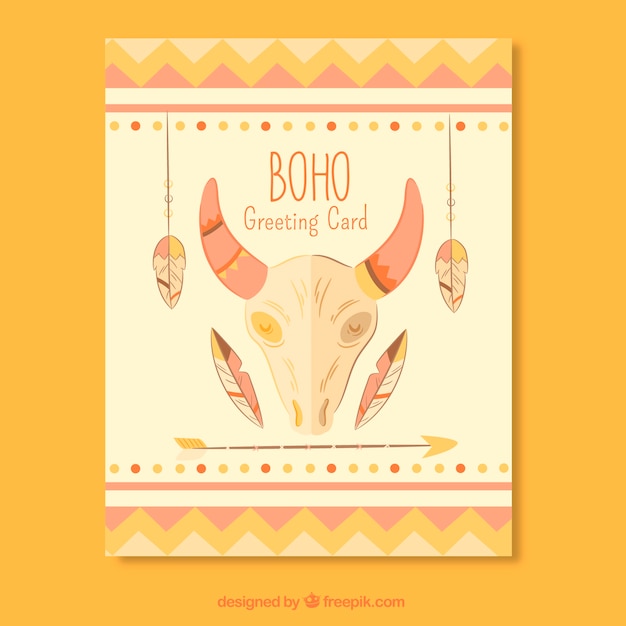 Flat greeting card with skull and ornamental feathers