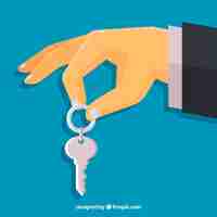 Free vector flat hand holding house key background