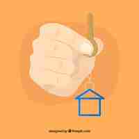Free vector flat hand holding house key background