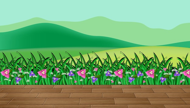 Цветочное поле и зеленая трава с горным фоном