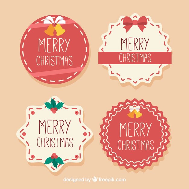 Four beige and red christmas badges
